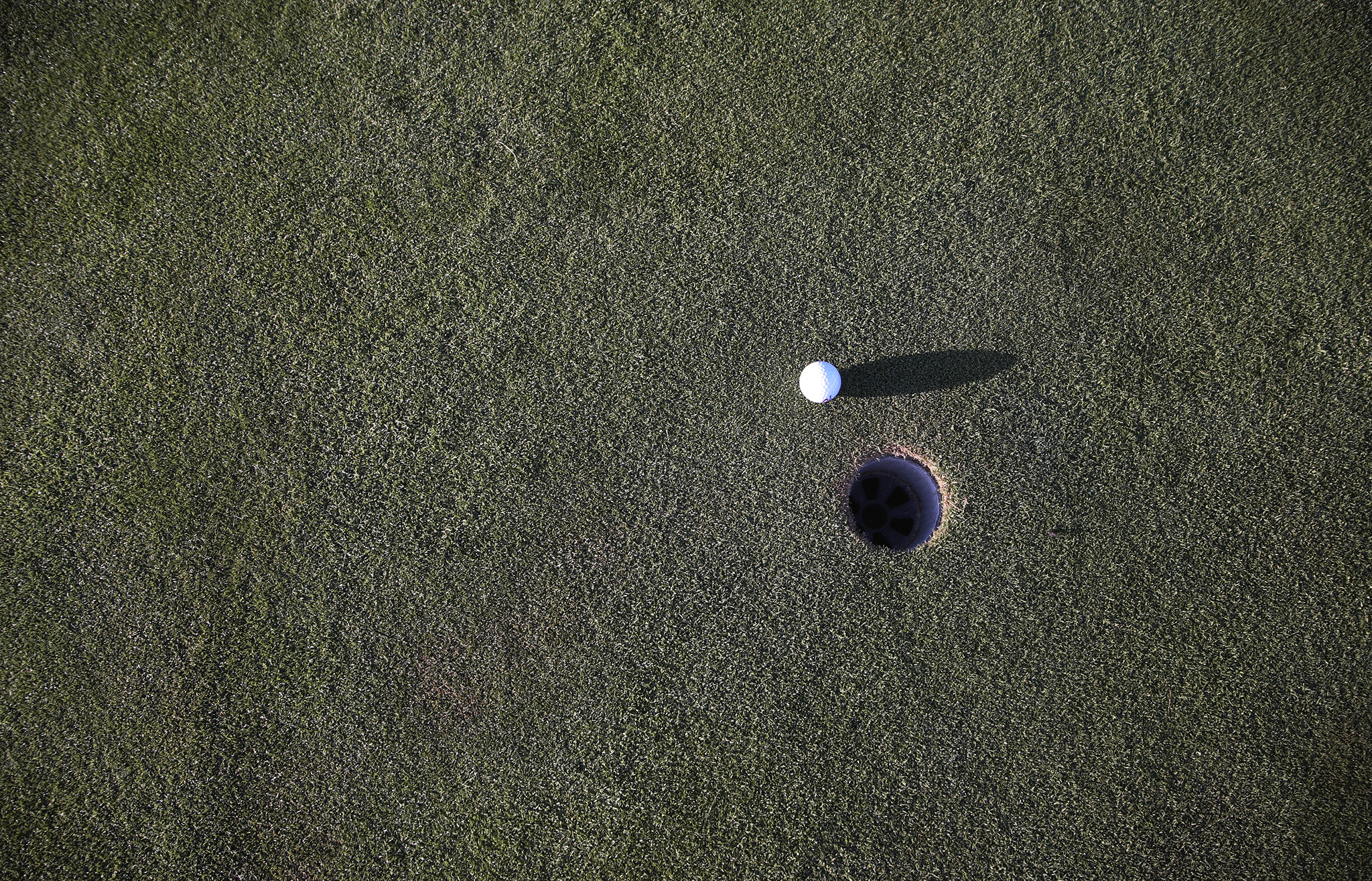 Golf ball near hole